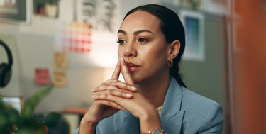 Person thinking about their choices before making a decision