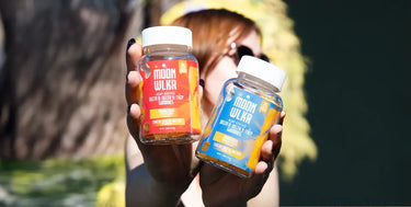 Person holding up two bottles of THCP Gummies