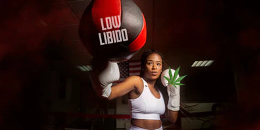 Woman punching a speed bag that says low libido