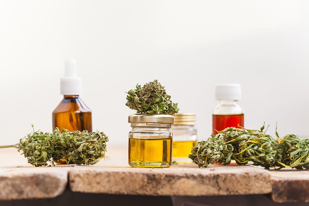 Cannabis flowers and extraction jars and tinctures