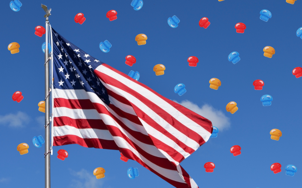 American flag flying in the sky with amanita mushroom gummies raining down