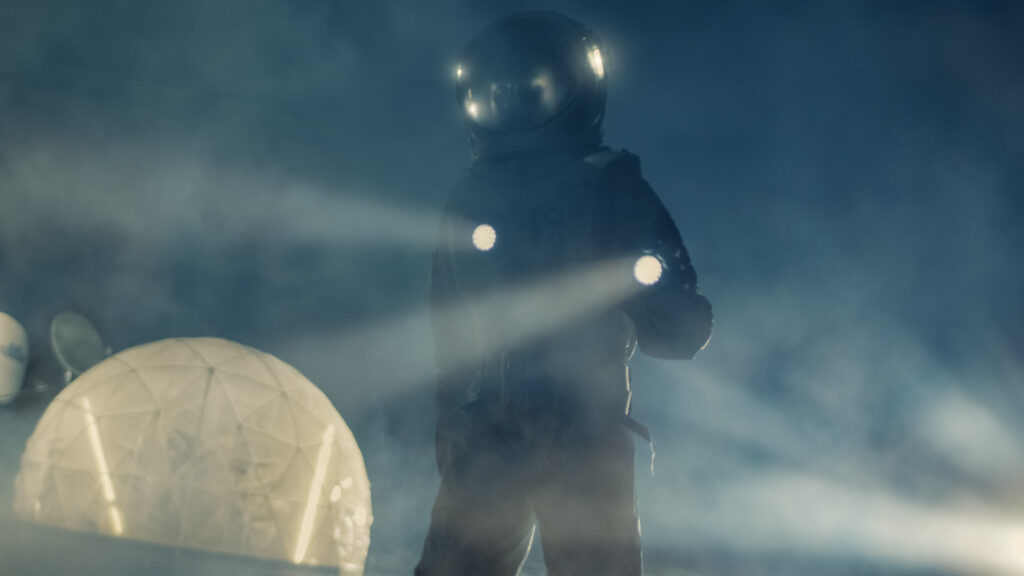 An Astronaut searching in the dark with a flashlight